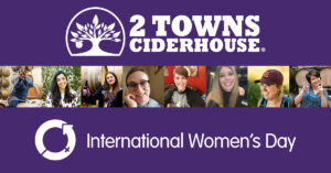 Photos of 8 female 2 Towns employees are highlighted above the "International Women's Day" badge, with the 2 Towns Ciderhouse logo at the top of the image.