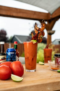 Photo of a bloody mary surrounded by ingredients