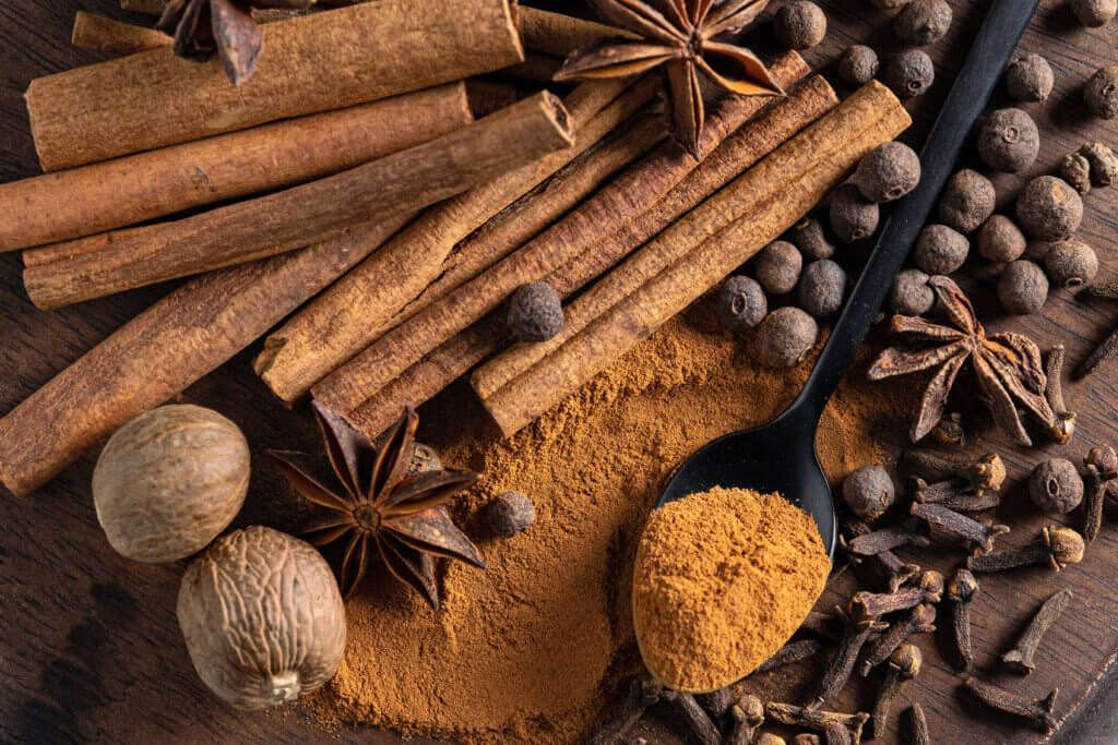 various spices on wooden board